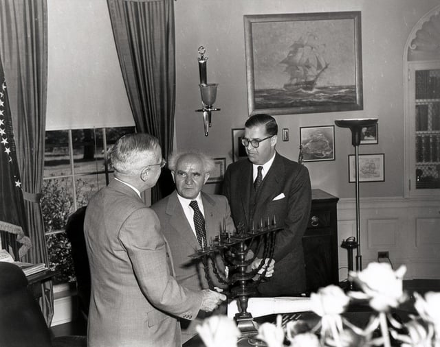 Truman in the Oval Office, receiving a Hanukkah Menorah from the prime minister of Israel, David Ben-Gurion (center). To the right is Abba Eban, ambassador of Israel to the United States