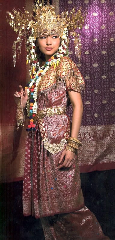 Indonesian girl wearing traditional Palembangese Songket