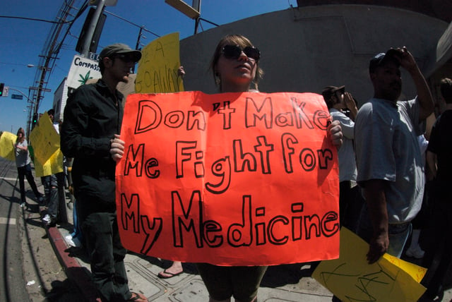 People protesting medical marijuana raids