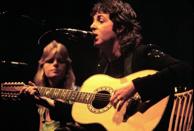 McCartney (right) performing with wife Linda (left) in 1976
