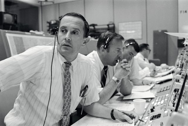 CAPCOM Charles Duke, with backup pilots James Lovell and Fred Haise listening in during Apollo 11's descent