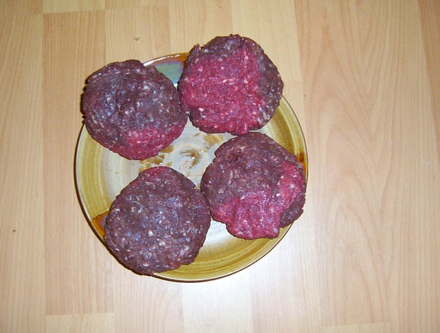 Approximately 0.45 kg (1 lb) of ground elk meat formed into patties; they have relatively low fat content