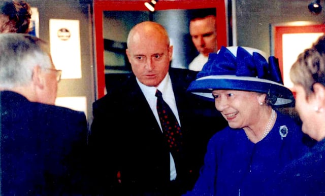 Queen Elizabeth II with Anthony J. Moses during her visit in Cardiff University in 2000