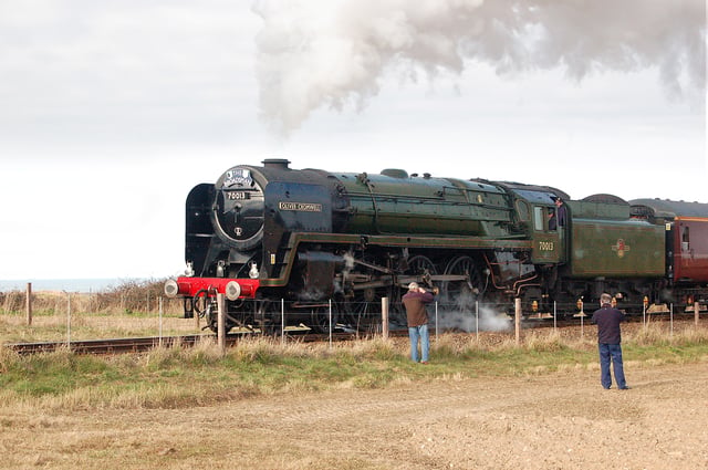 Heritage railways are popular tourist attractions. The photo shows a preserved locomotive (BR Standard 7MT 70013 Oliver Cromwell) on the North Norfolk Railway on 11 March 2010.