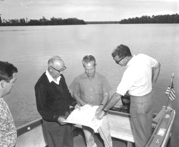 Roy O. Disney inspecting design plans on-site in Florida.
