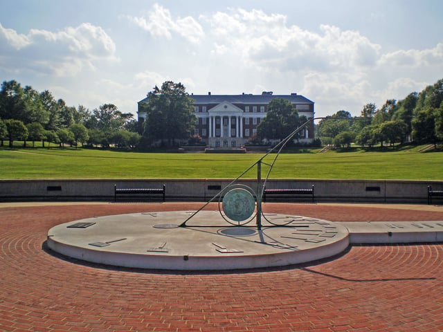 The sundial in the center of McKeldin Mall, with McKeldin Library in the background