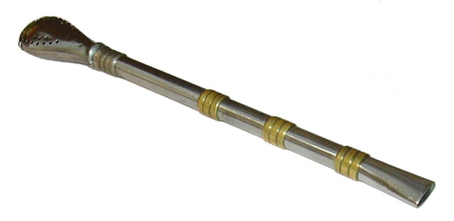 An ornate silver bombilla