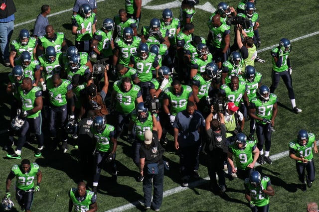 Seahawks players wearing green jerseys in 2009.