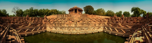 Sun Temple of Modhera, with stepwell surrounding the Kunda (tank), was built by Bhima I of Chaulukya dynasty in 1026. It is one of the finest examples of stepwell architecture of Gujarat.