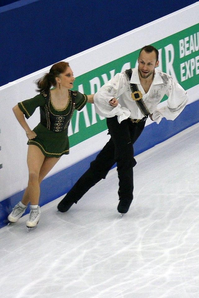 Pair skaters performing crossovers