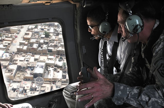 Petraeus explains security improvements in Sadr City while giving an aerial tour of Baghdad to Senator Barack Obama, July 2008