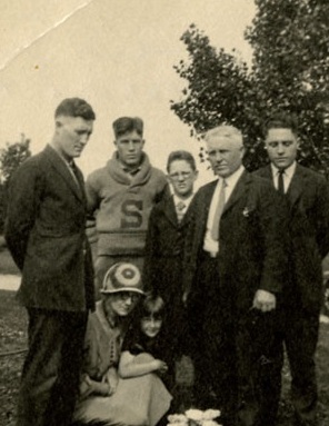 The family in Idaho in 1921, visiting the grave of George's younger brother Lawrence, who died that year of rheumatic fever. George is standing, second from left. His mother Anna is sitting on the left while his father Gaskell is standing, second from right.