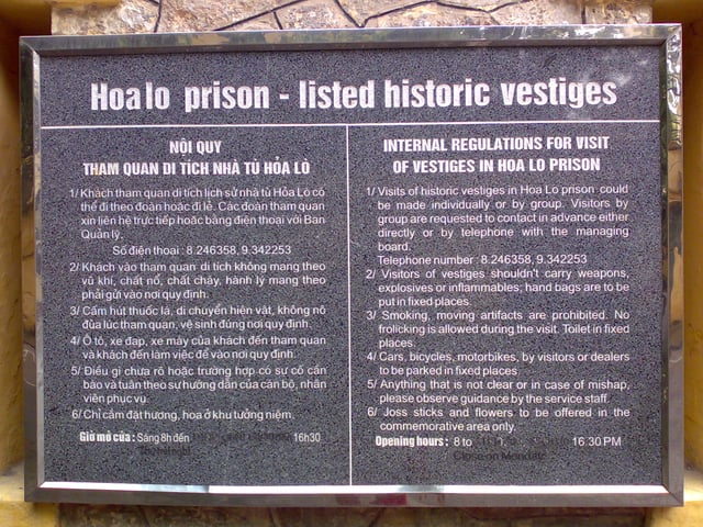 A sign at the Hỏa Lò Prison museum in Hanoi lists rules for visitors in both Vietnamese and English.