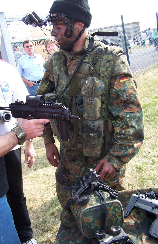 A German Army soldier demonstrates the MP7A1 of the IdZ program