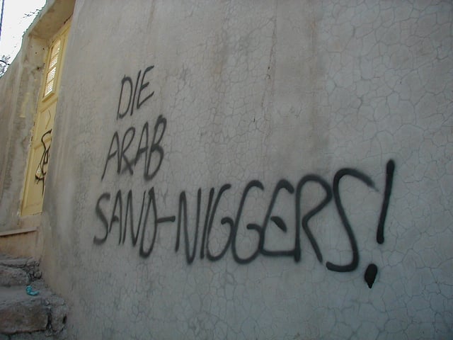 Graffiti reading "Die Arab Sand-Niggers!" reportedly sprayed by settlers on a house in Hebron.