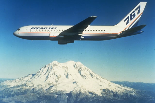 The first 767-200 built, N767BA, in flight near Mount Rainier in the 1980s.
