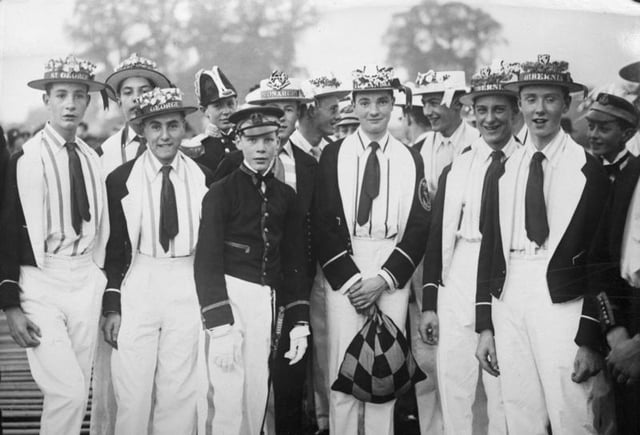 Pupils at Eton College dressed as members of various rowing crews taking part in the "Procession of Boats" on the River Thames during the "Fourth of June" celebrations 1932
