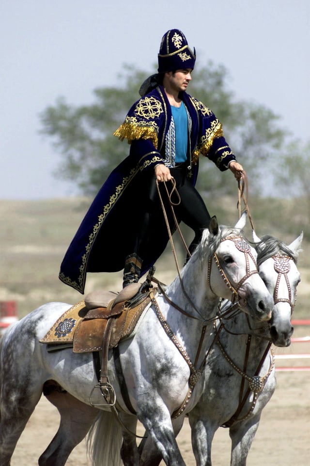 A Kazakhstan performer demonstrates the long equestrian heritage as part of the gala concert during the opening ceremonies of the Central Asian Peacekeeping Battalion.