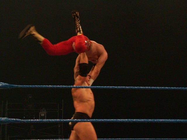 Lesnar demonstrating his strength on Eddie Guerrero during a SmackDown! taping in February 2004