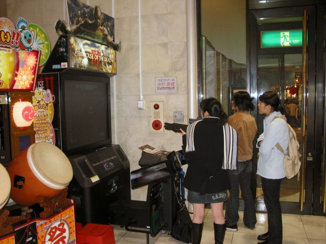 Girls playing The House of the Dead III in an amusement arcade in Japan, 2005.