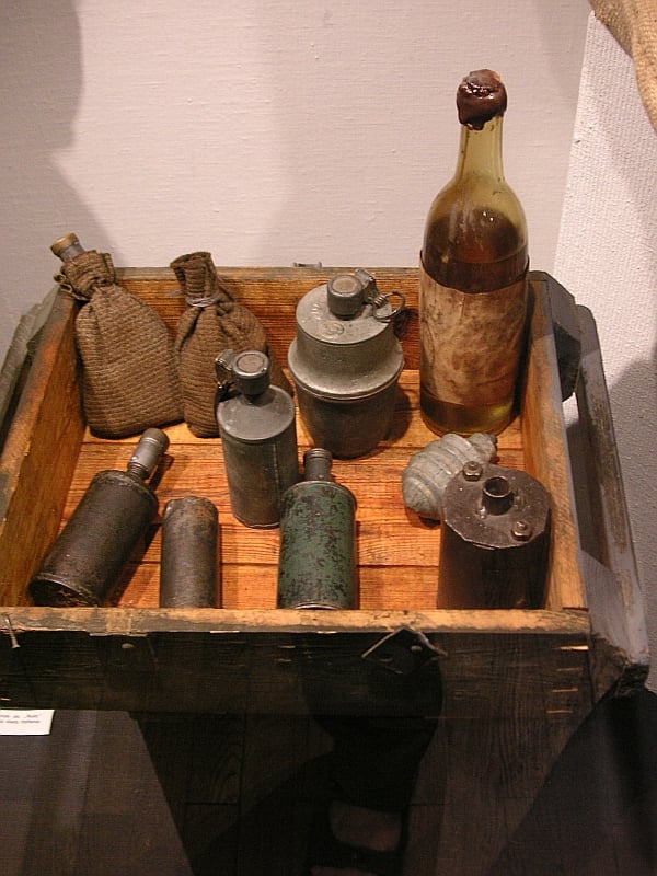 A display of improvised munitions, including a Molotov cocktail, from the Warsaw Uprising, 1944