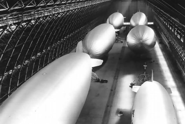 A view of six helium-filled blimps being stored in one of the two massive hangars located at NAS Santa Ana, during World War II.