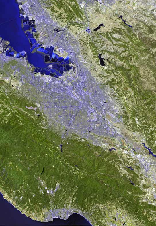 A satellite image of the Santa Clara Valley in the South Bay Area; San Jose makes up most of the urbanization in the center of the valley.