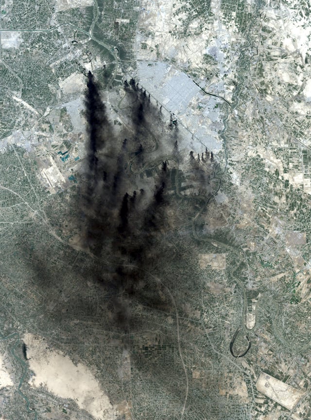 NASA Landsat 7 image of Baghdad, 2 April 2003. The dark streaks are smoke from oil well fires set in an attempt to hinder attacking air forces