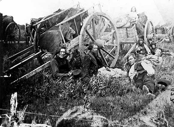 Métis drivers with Red River carts, c. 1860