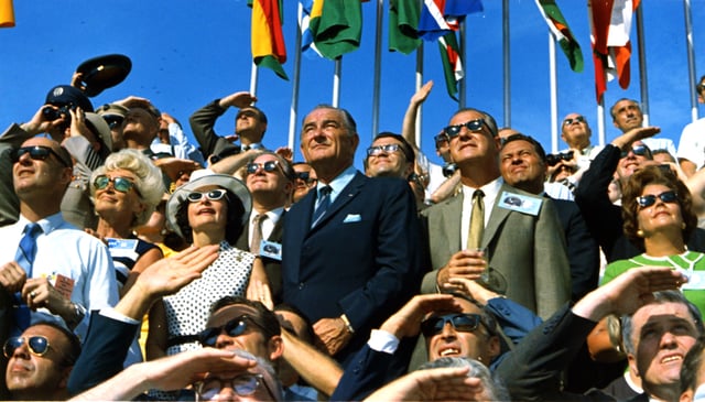 Johnson (center left) and Vice President Spiro Agnew (center right) witness the liftoff of Apollo 11.