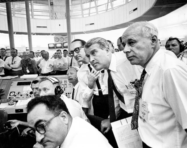 George Mueller, Wernher von Braun, and Eberhard Rees watch the AS-101 launch from the firing room.
