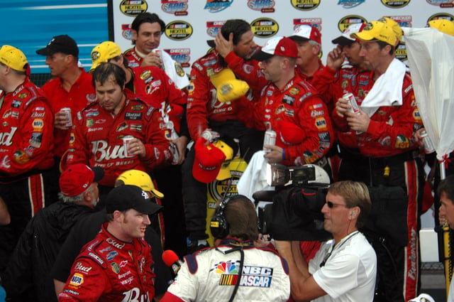Dale Earnhardt Jr. (bottom), and team in victory lane in 2004