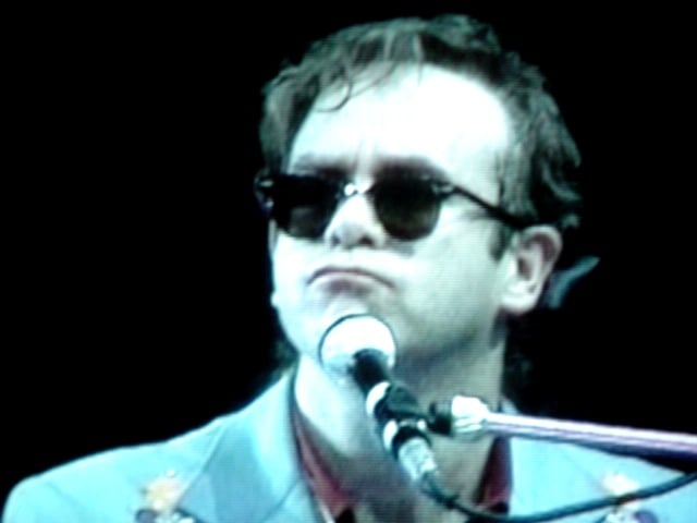 Elton John performing in the 1980s