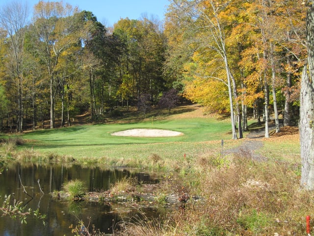 Water hazard, sand trap, and dense vegetation on the 13th hole at Ridgefield Golf Course, Connecticut