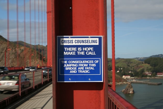 As a suicide prevention initiative, this sign promotes a special telephone available on the Golden Gate Bridge that connects to a crisis hotline.