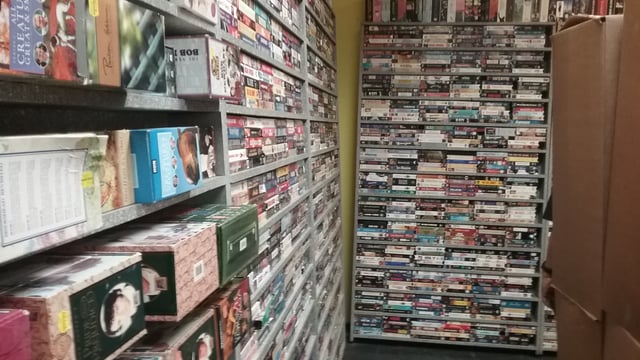 A Rasputin Music retailer (Fresno, CA) selling used VHS cassettes from 50¢ to $1.98 each for people who still have working VCRs.
