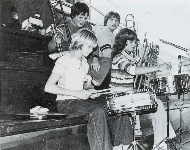 Cobain playing drums at an assembly at Montesano High School