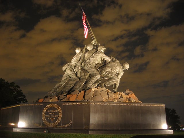 Photograph of the Marine Corps War Memorial, which depicts the second U.S. flag-raising atop Mount Suribachi, on Iwo Jima. The memorial is modeled on Joe Rosenthal's famous Raising the Flag on Iwo Jima.