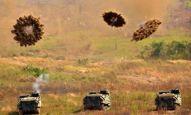 Amphibious Assault Vehicles firing smoke grenades