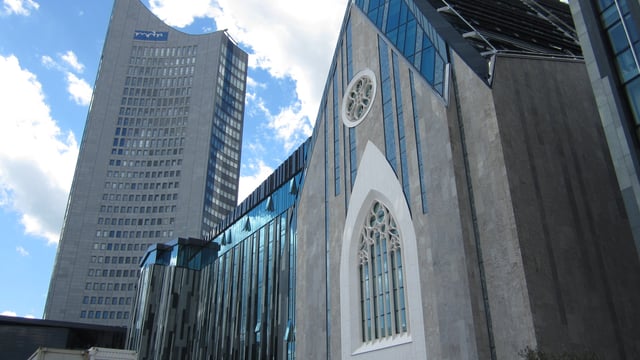 The 153-metre-high City-Hochhaus Leipzig and the Augusteum of the University of Leipzig