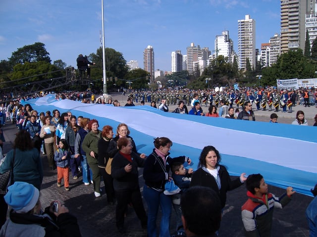 Participants carry the national colors on Flag Day (June 20).