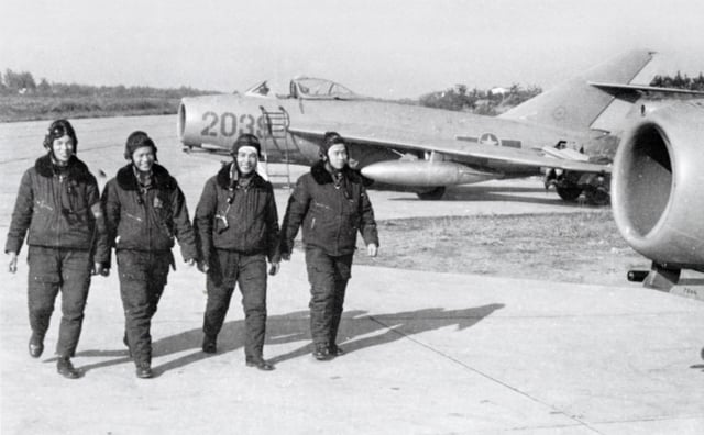 North Vietnamese Air Force pilots walk by their aircraft, the MiG-17. The development of the North Vietnamese Air Force during the war was assisted by Warsaw Pact nations throughout the war. Between 1966 and 1972 a total of 17 flying aces was credited by the NVAF against US fighters.