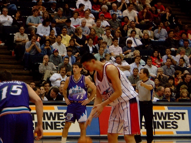 Yao prepares to shoot a free throw with John Stockton in the background