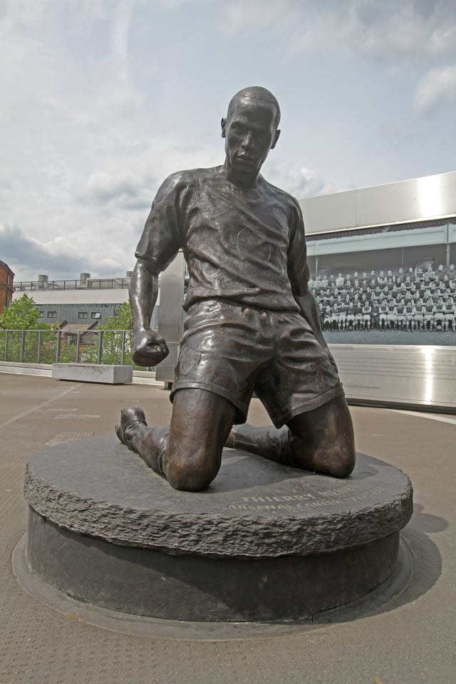 Henry statue outside Arsenal’s Emirates Stadium. The statue recreates Henry’s fabled celebration where he slid to his knees after a goal against Spurs in 2002.