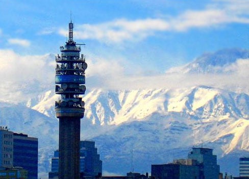 Torre Entel in Santiago de Chile, with the Andes mountains in the background