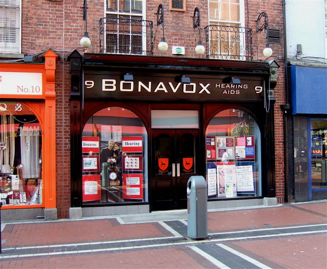 The hearing aid shop, Bonavox, that provided Hewson with the nickname "Bono Vox".