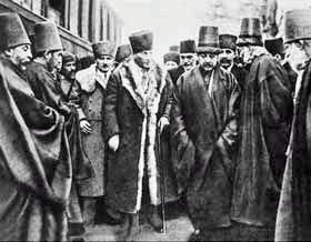 Mustafa Kemal Pasha in 1923, with members of the Mevlevi Order, before its institutional expression became illegal and their dervish lodge was changed into the Mevlana Museum. The Mevlevi Order managed to transform itself into a non-political organization which still exists.