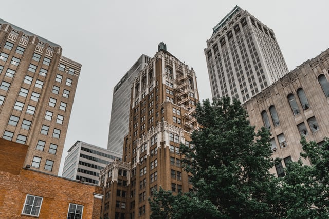 The Philtower, built in the late Gothic Revival style, is surrounded by contemporary office buildings.