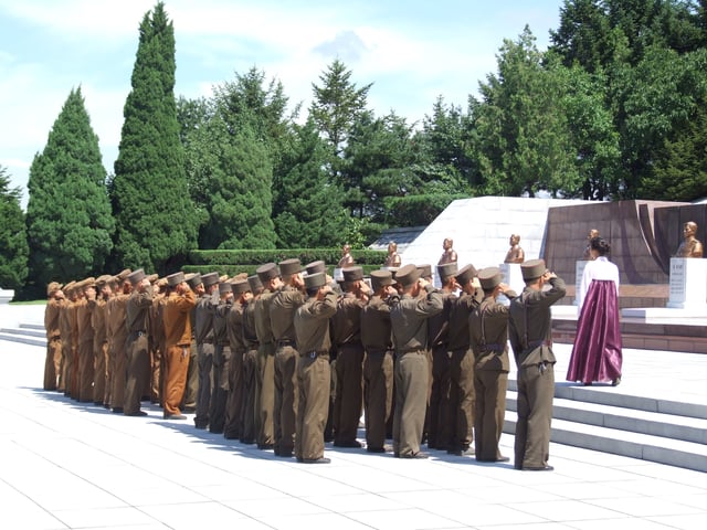 North Korean soldiers saluting at the Revolutionary Martyrs' Cemetery in Pyongyang, 2012