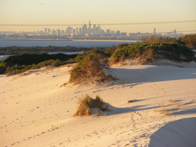Kurnell Sand Dunes with the Sydney skyline in the background.